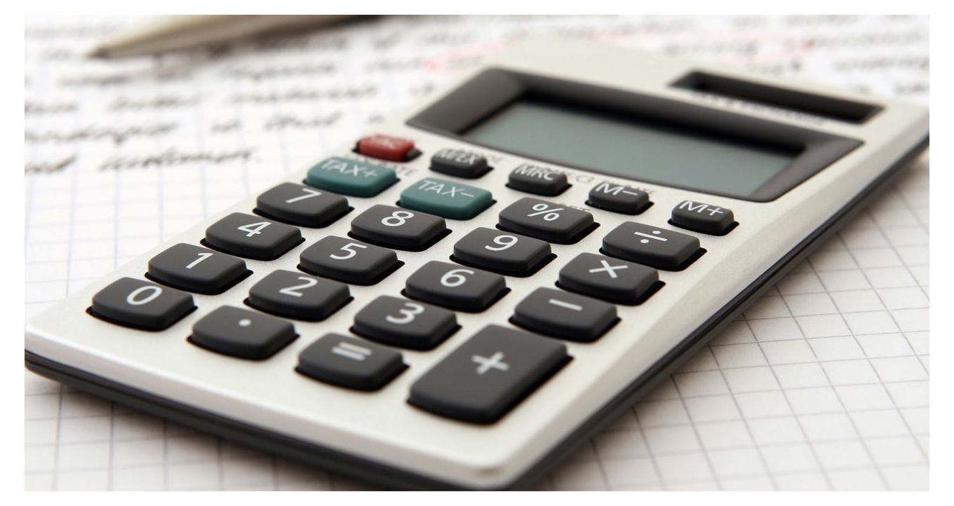 Custom Packaging Cost - Close-up image of a calculator placed on top of a sheet of paper.