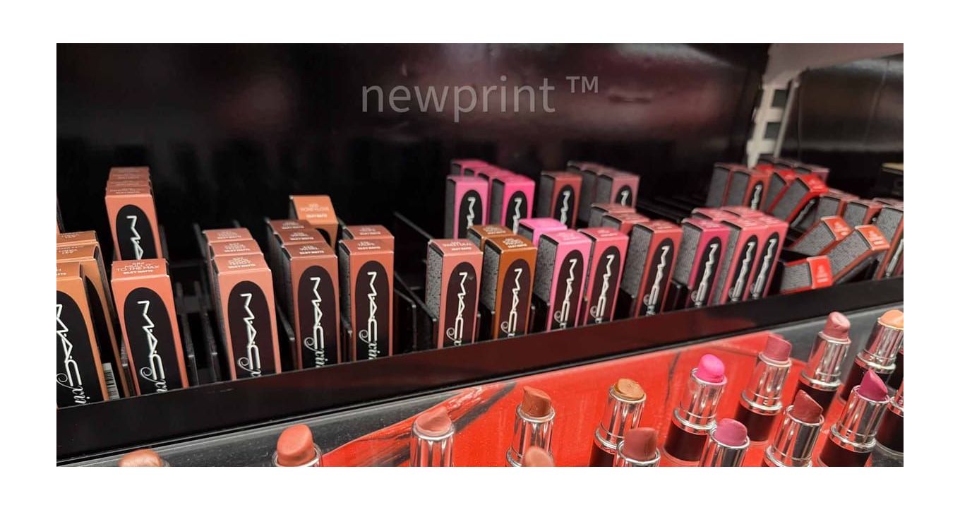 Cosmetic lipstick products and their packaging arranged on the shelf.