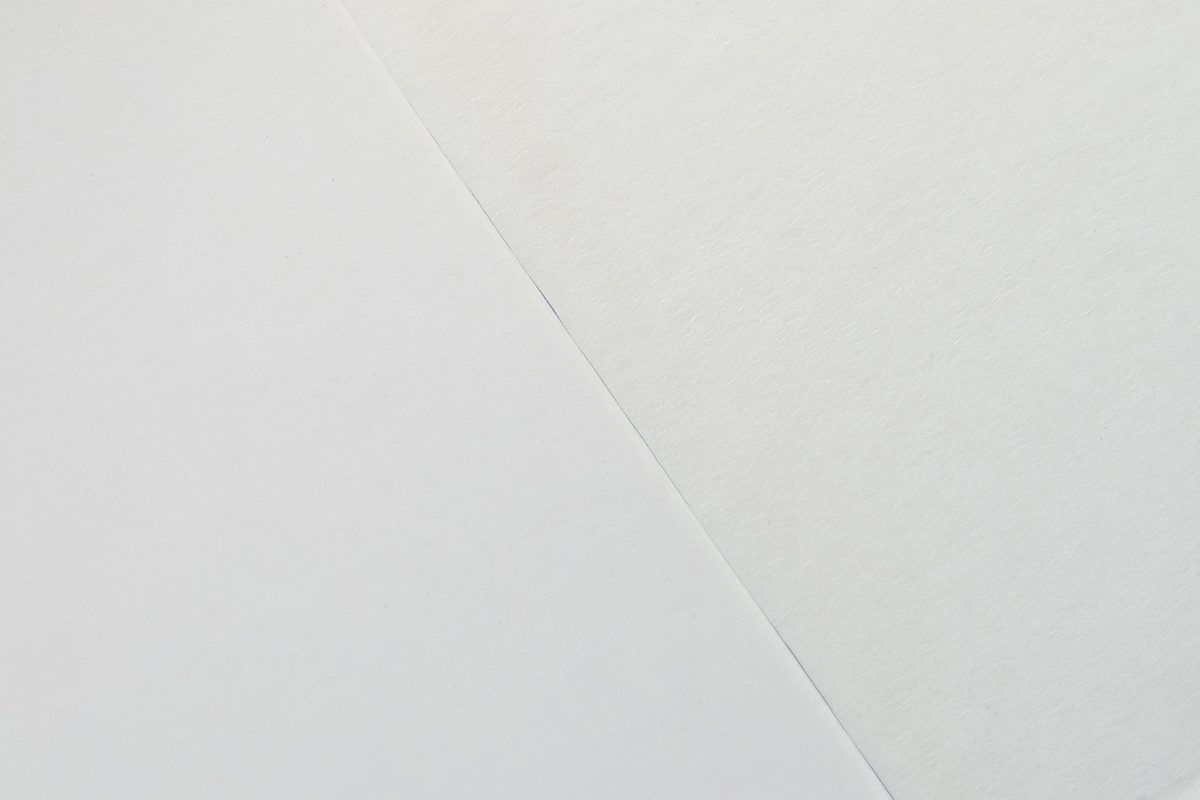 Image showing the difference between coated and uncoated paper for Card Sleeve Envelope Fold-Over Tuck.