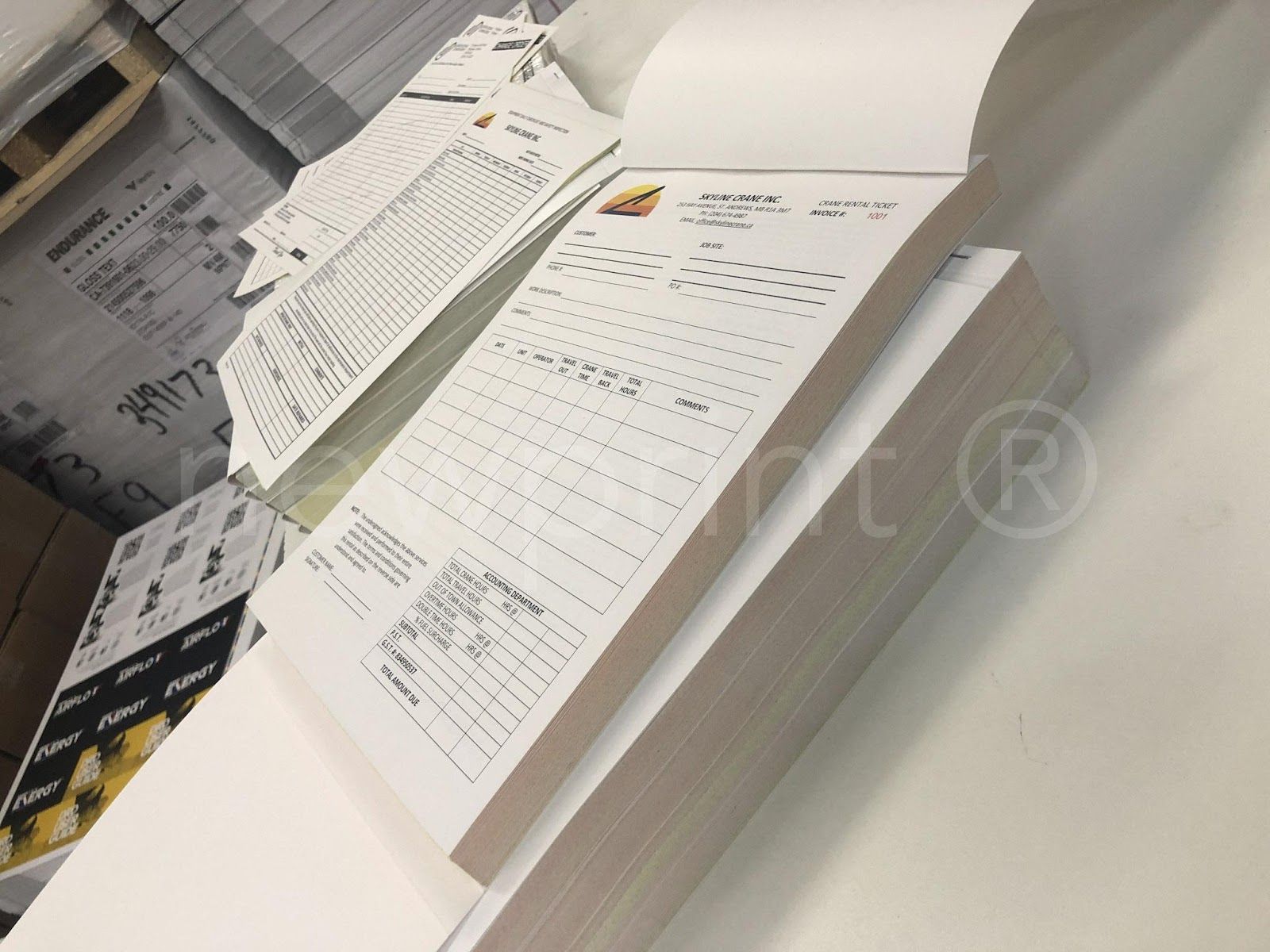 Stack of NCR forms, top one is open.