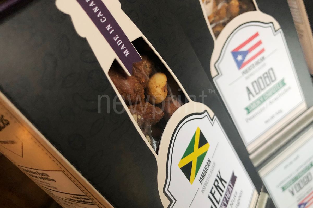Close-up of a nuts mix custom food packaging box showing a cutout in the middle of the box.