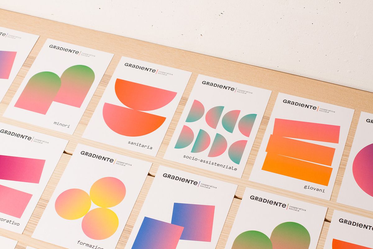 Example of graphic design trends –different examples of muted gradients layed out on a flat surface