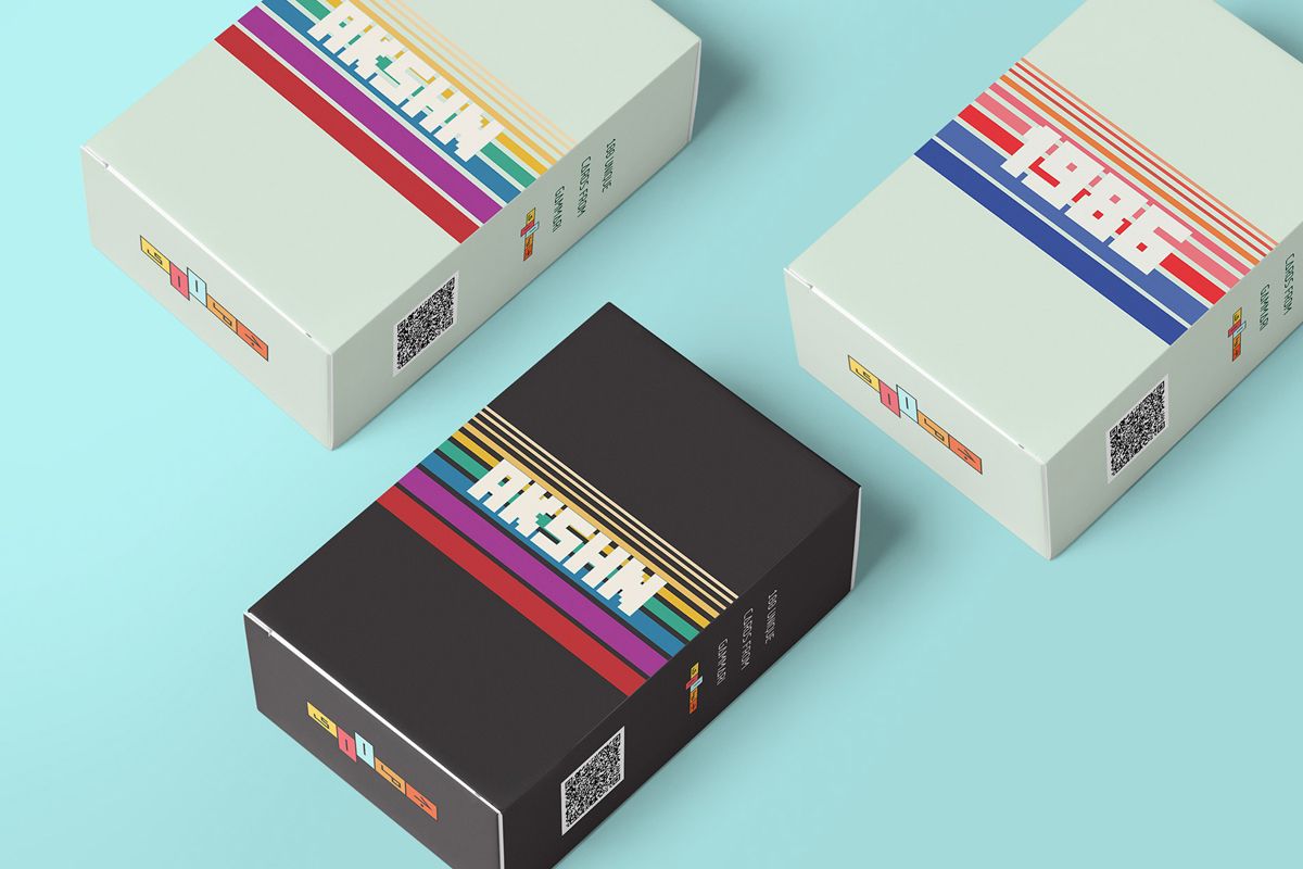 Example of graphic design trends for 2022 – three packaging boxes with minimalistic design on the flat surface