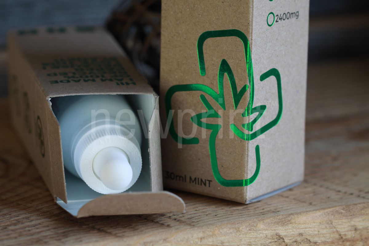 Guide to Custom Packaging-Two kraft paper packaging boxes with green foil details.