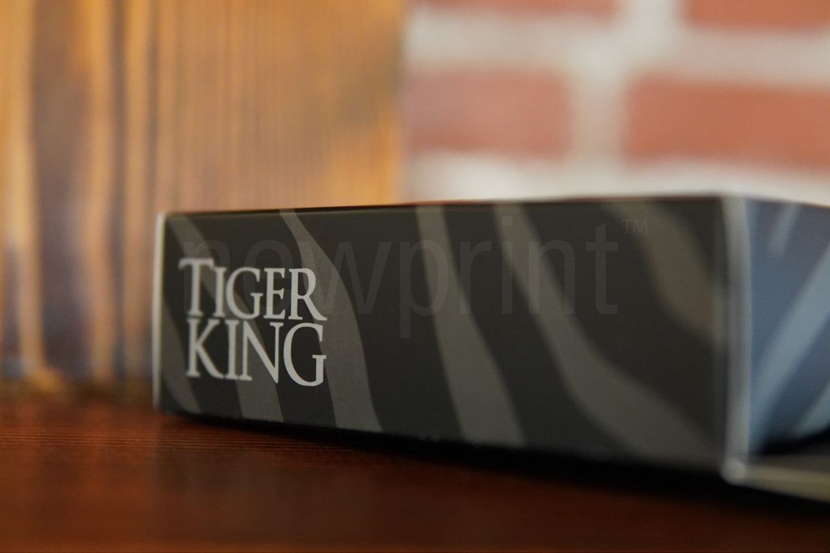 What is custom packaging - Side-view of the Tiger King underwear packaging laying flat on a desk.