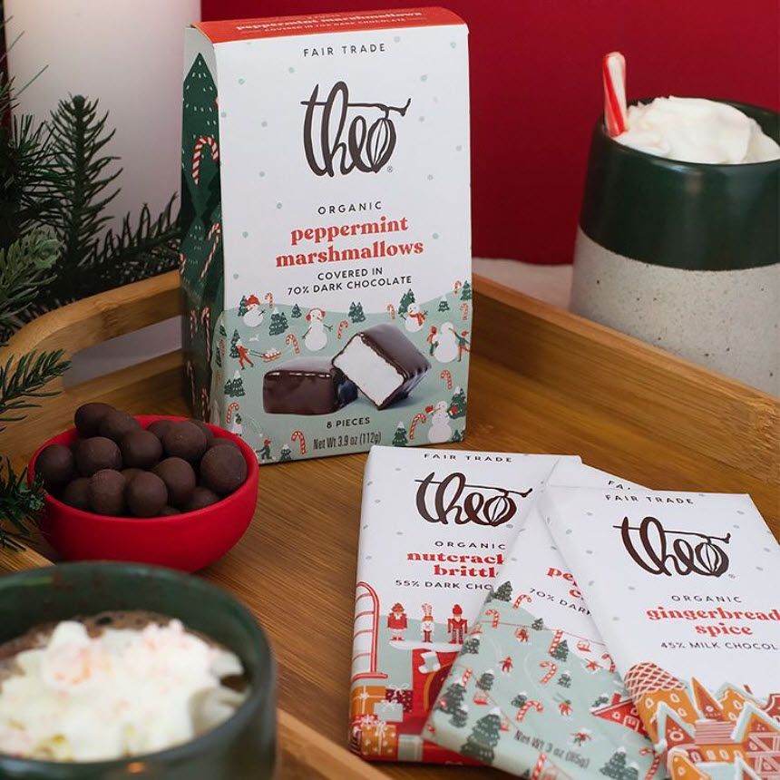 Chocolates with holiday packaging laid out on a tray