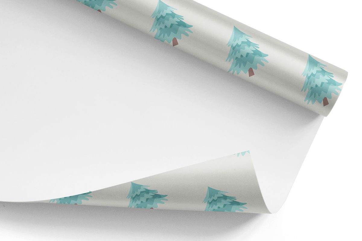 Wrapping paper with a tree on it as an example of holiday gift packaging ideas