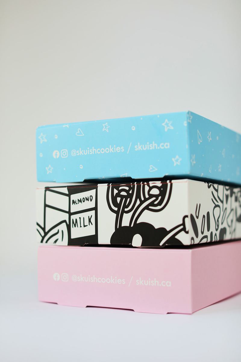 three closed Skuish custom cookie box packaging boxes