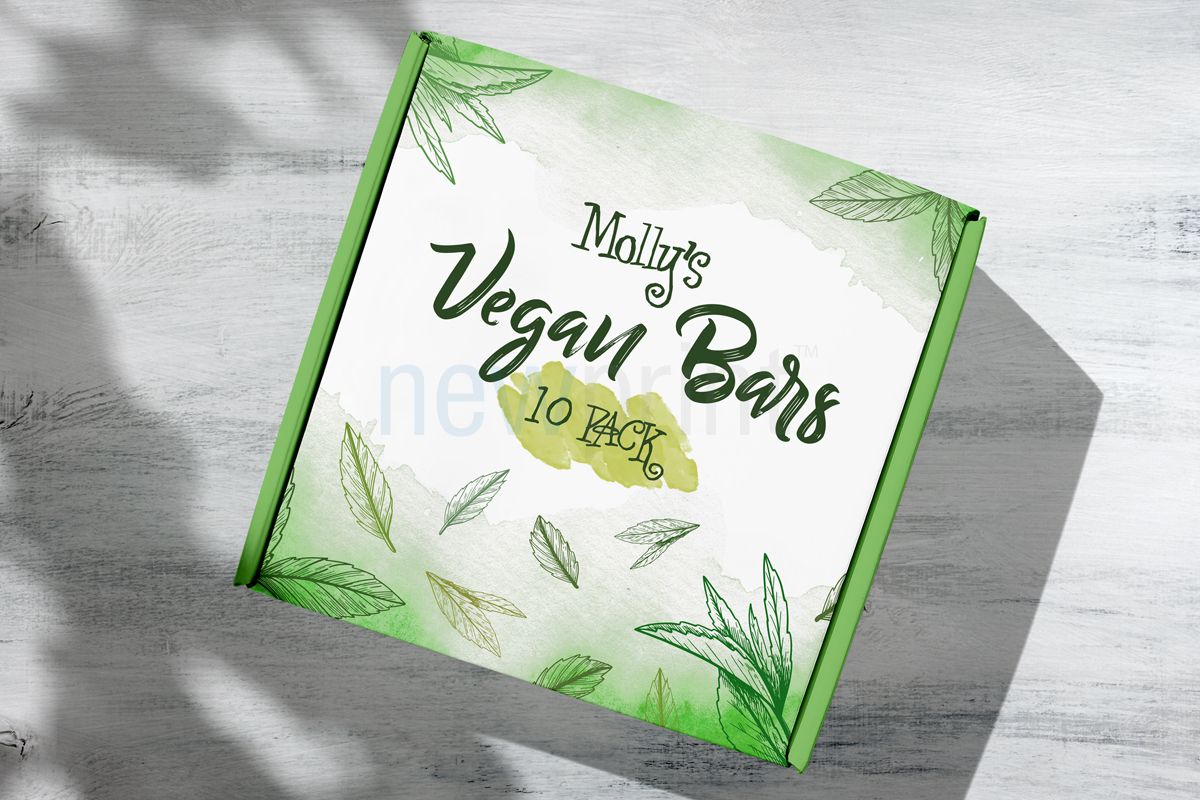 packaging colour - Top view of a green and white box for vegan bars packaging.