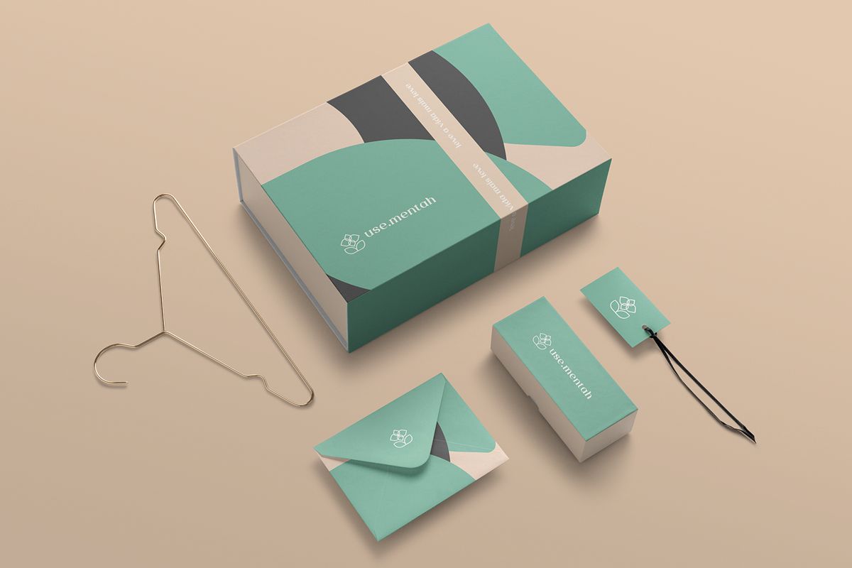 Green and beige packaging elements for creating the ultimate unboxing experience on the flat surface