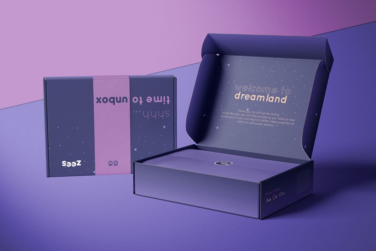 Dark blue boxs open and closed with purple belly band to illustrate the ultimate unboxing experience
