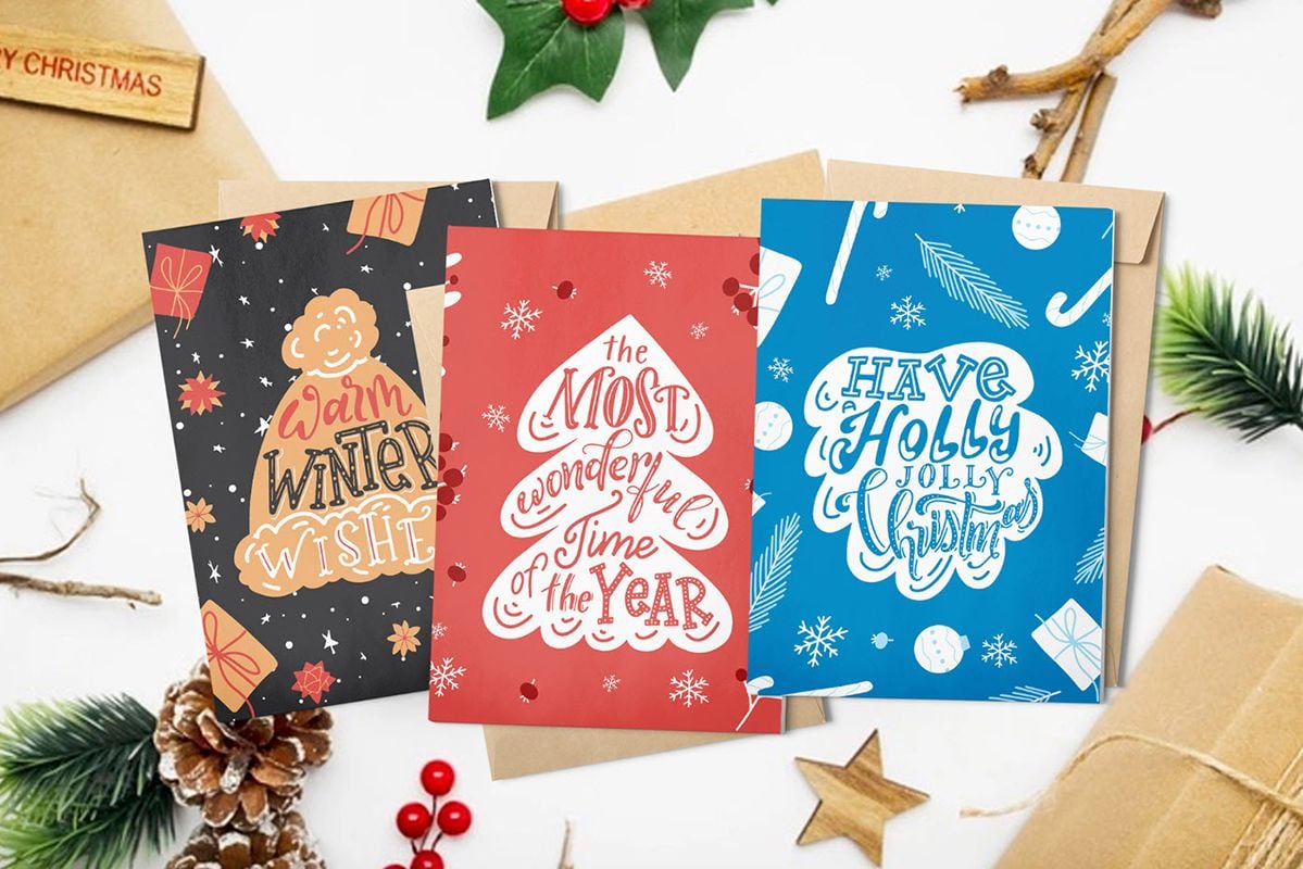 Christmas packaging design inspiration, three holiday cards with Christmas decorations around.