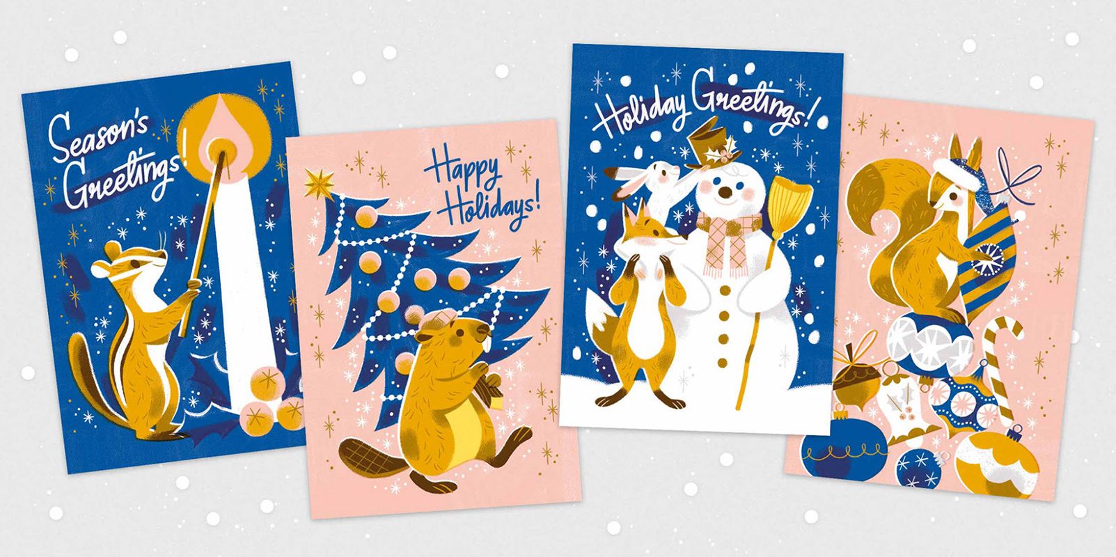 Four greeting cards with a holiday-inspired design on a gray background.