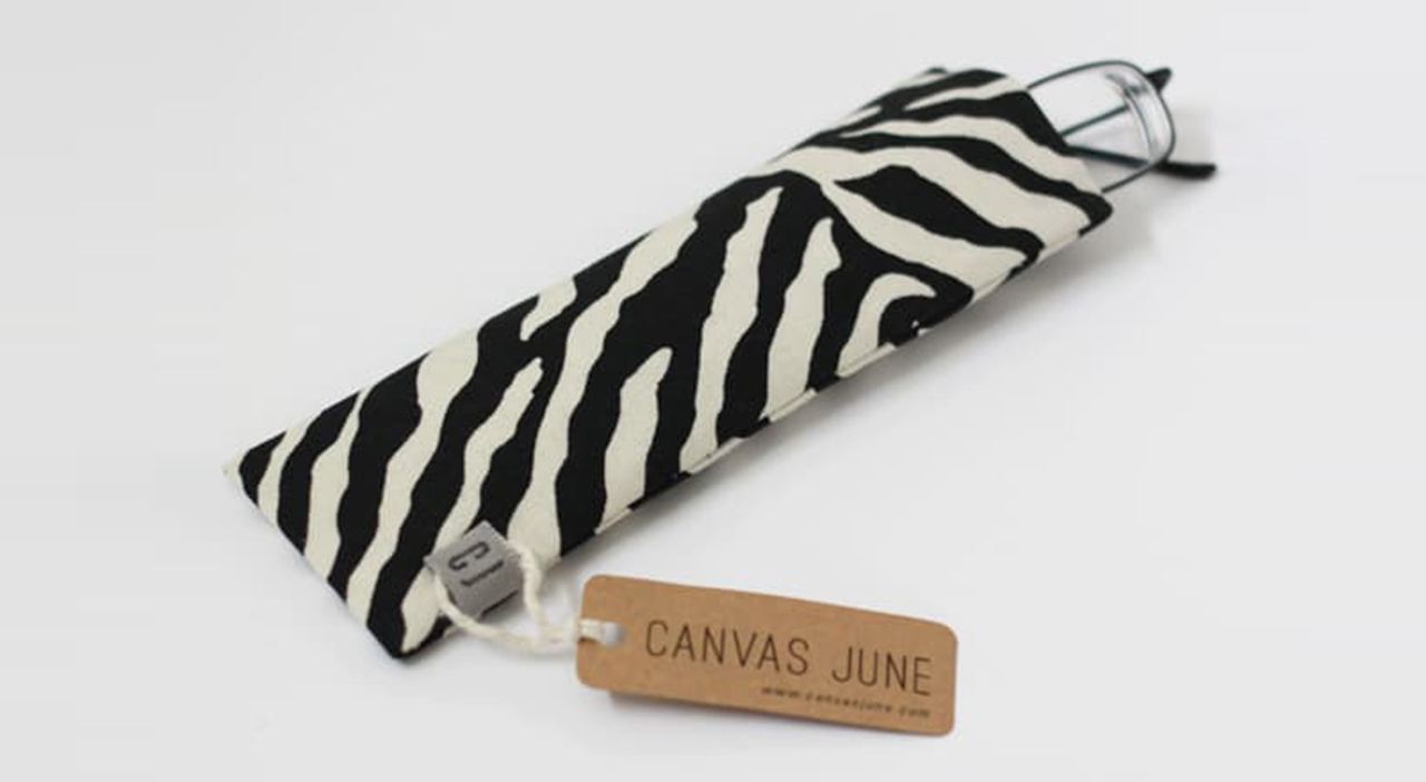 Zebra designed glasses case with one of the simpler hang tag examples with just brand name on kraft paper.