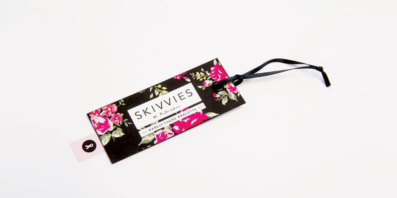 One of the hang tag examples - black with a floral design and a brand name.