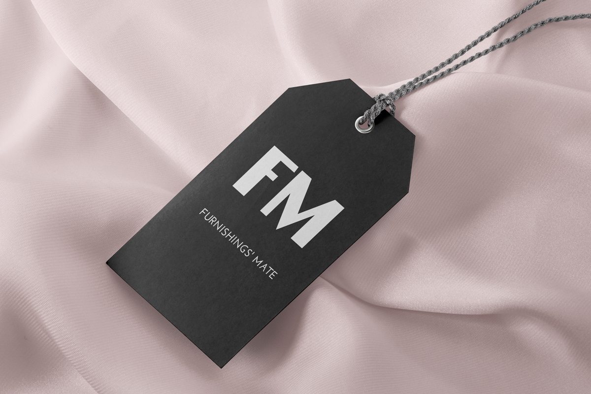 Custom printed hang tag on a pink silk background.