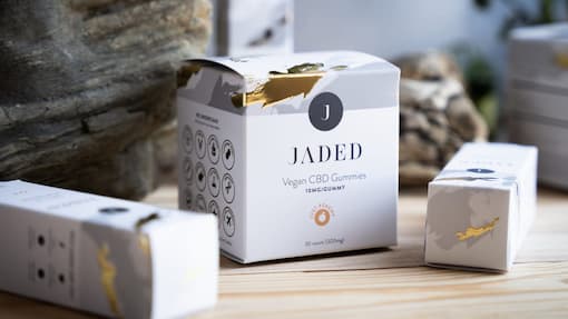 White CBD cannabis boxes with gold foil details