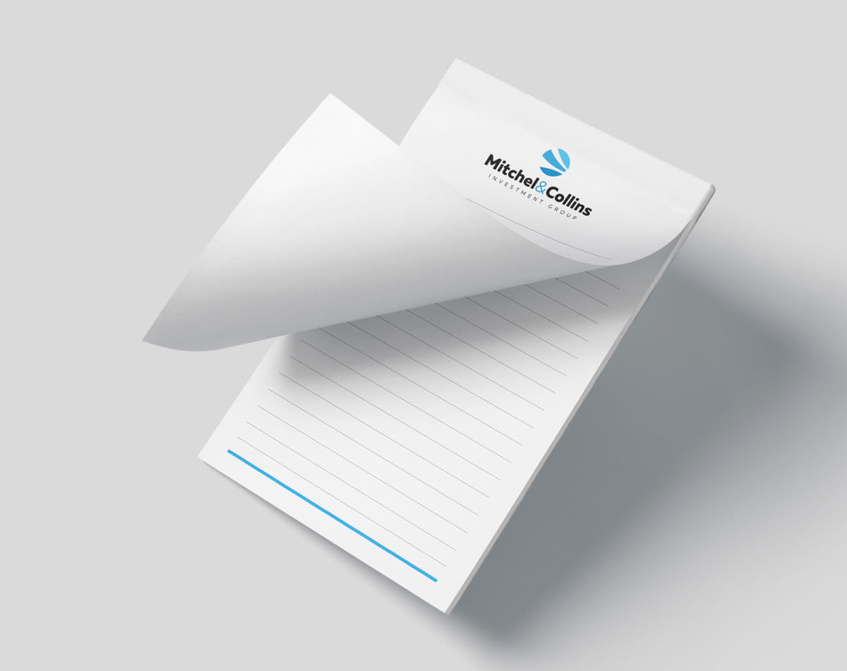 Image showing lined notepad with logo and first page folded.