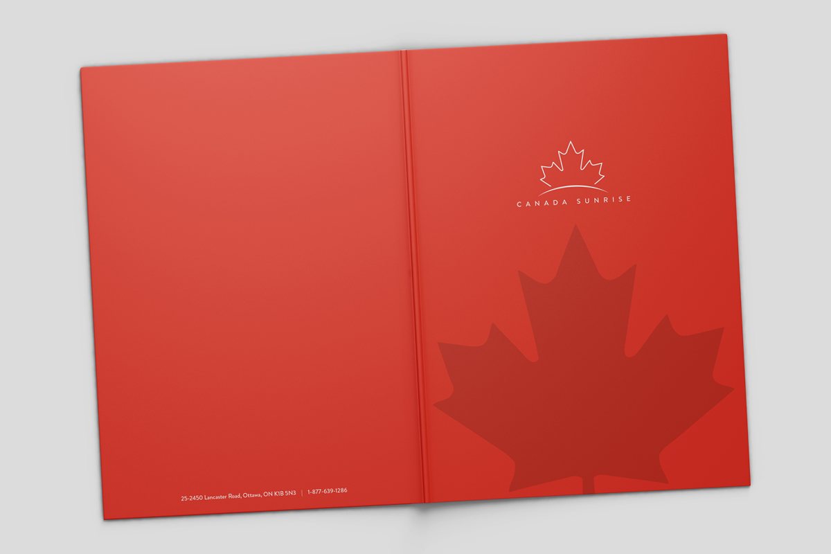 Image showing outside of open red Presentation Folder with maple leaf design.
