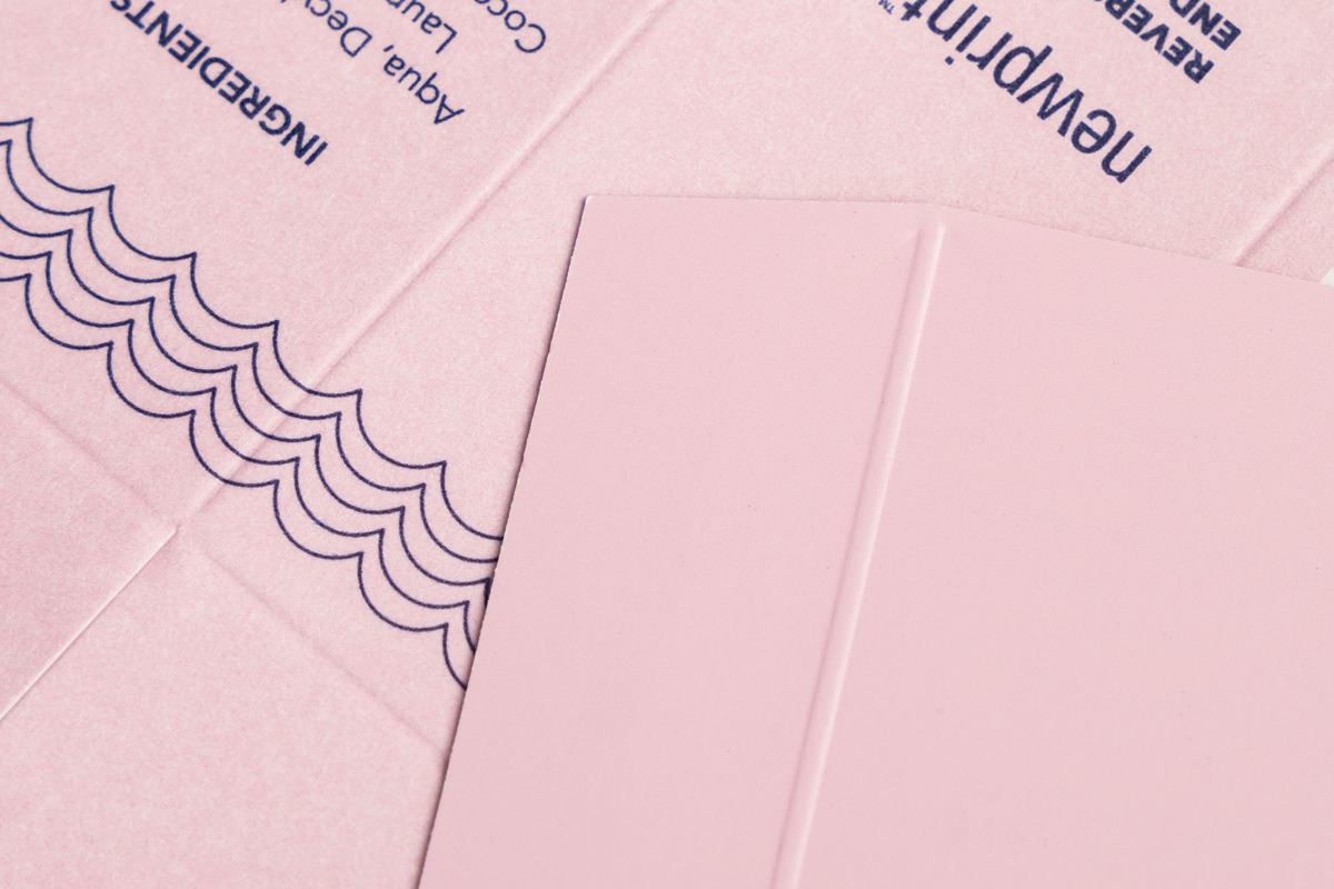 Printing paper options - coated and uncoated card stock next to each other.