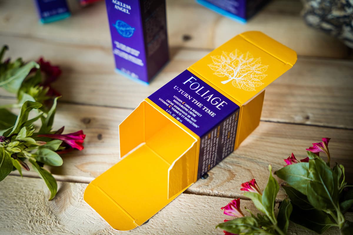 Image showing three colorful Reverse Tuck End boxes stacked on top of each other.