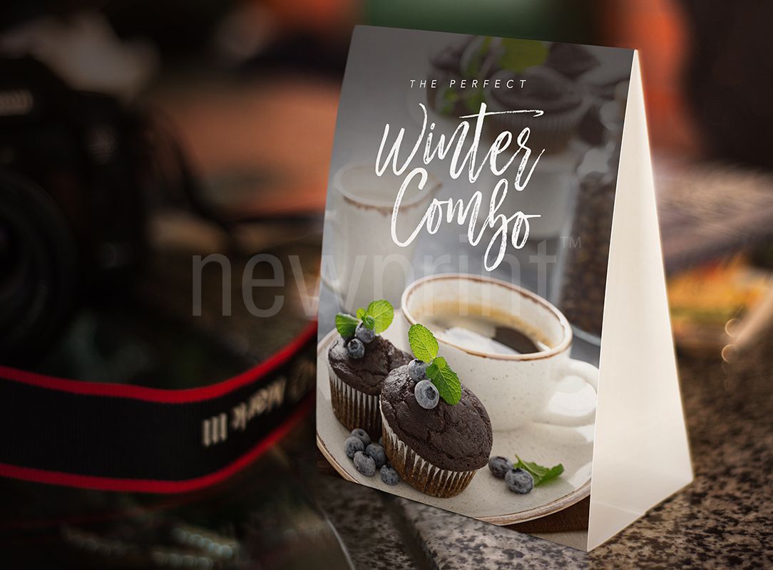 Seasonal marketing ideas - table tent card advertising coffee and blueberry muffins as a perfect winter combo.