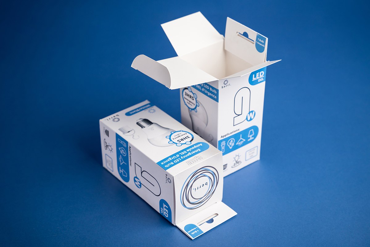 Packaging solutions - two paperboard boxes on blue background. One is open and the other is closed.